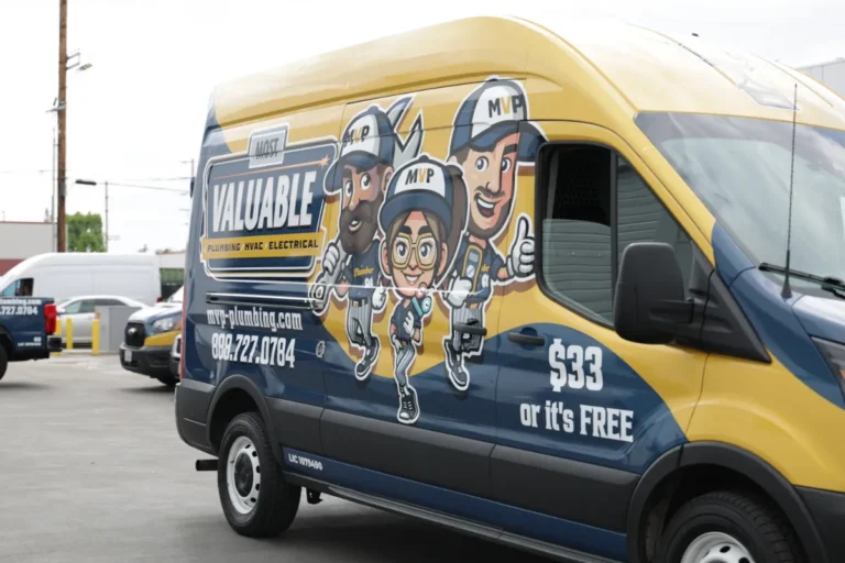 A commercial van with cartoon characters and company branding advertises plumbing, HVAC, and electrical services with a "$33 or it's free" offer and contact information.